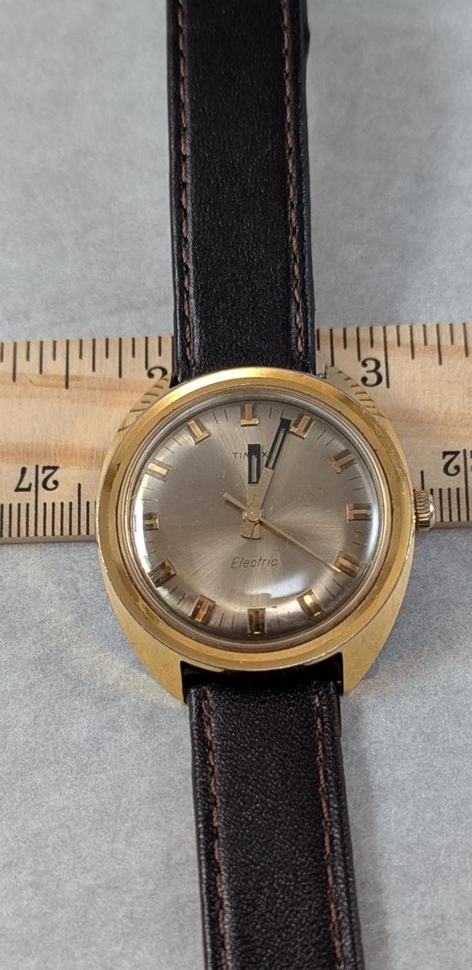 1970s Timex Electric Watch: Gold Tone Bezel, Retro Design
