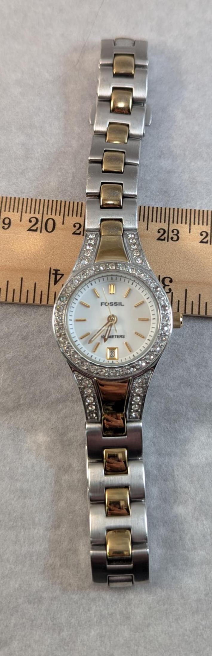 Fashionable and Stylish FOSSIL Ladies Watch - Silver and Gold Tone with MOP Dial and Crystal Bezel. Quartz Analog New Battery - Working