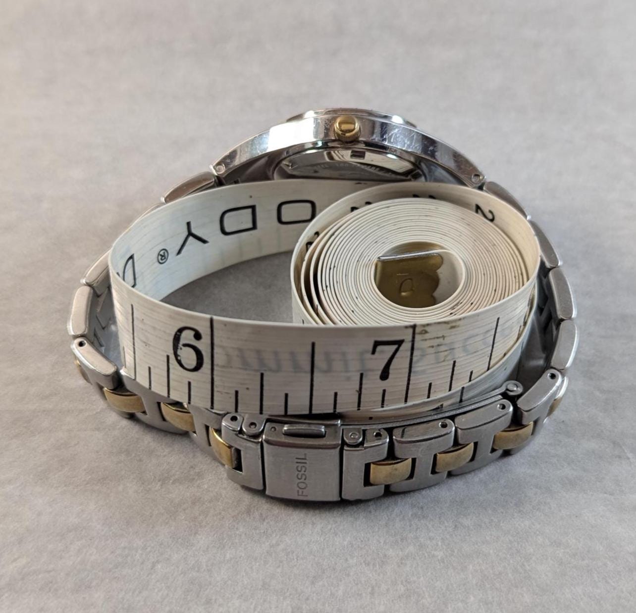 Fashionable and Stylish FOSSIL Ladies Watch - Silver and Gold Tone with MOP Dial and Crystal Bezel. Quartz Analog New Battery - Working