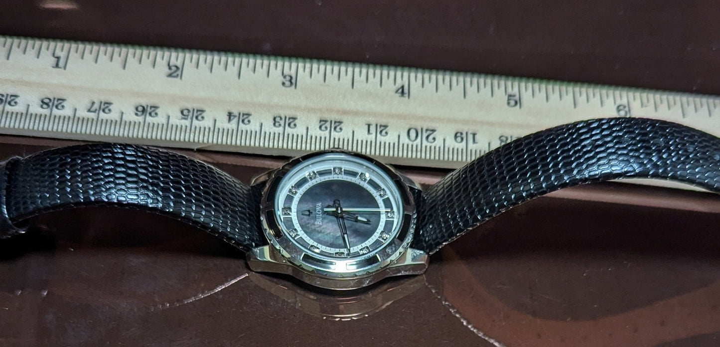 Bulova Ladies Watch: Mother of Pearl Dial, Diamond Hour Marks, Enamel Inlayed Case