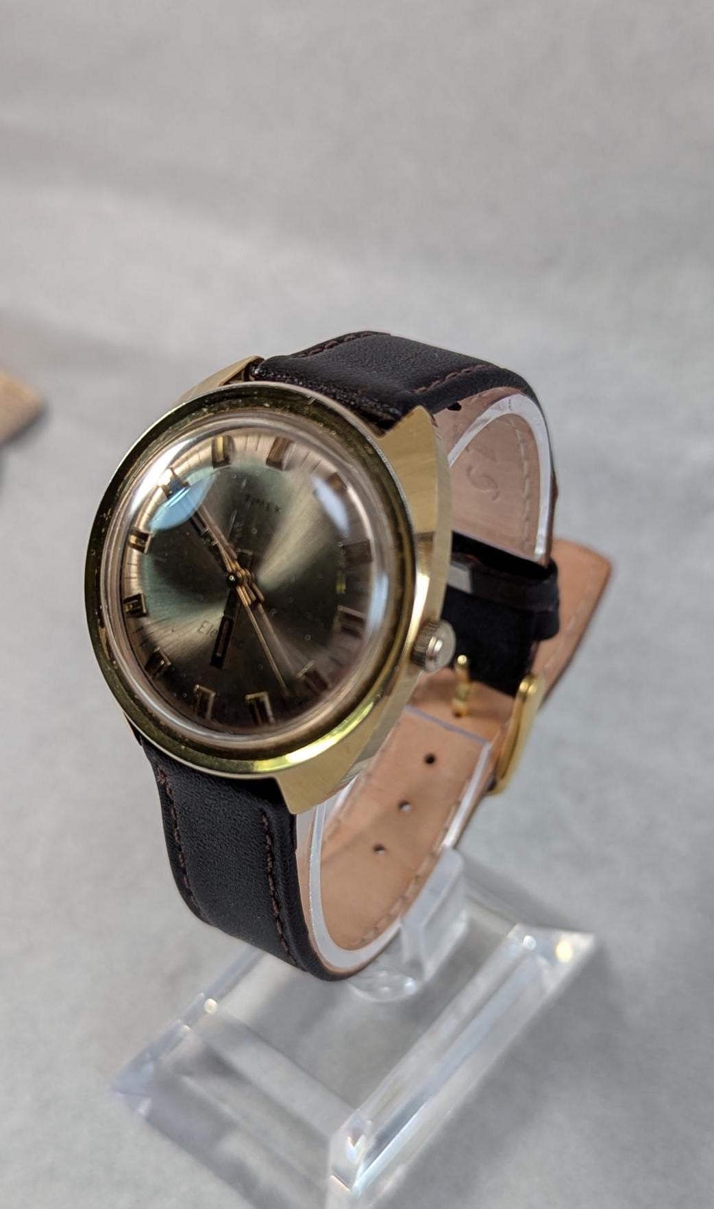 1970s Timex Electric Watch: Gold Tone Bezel, Retro Design