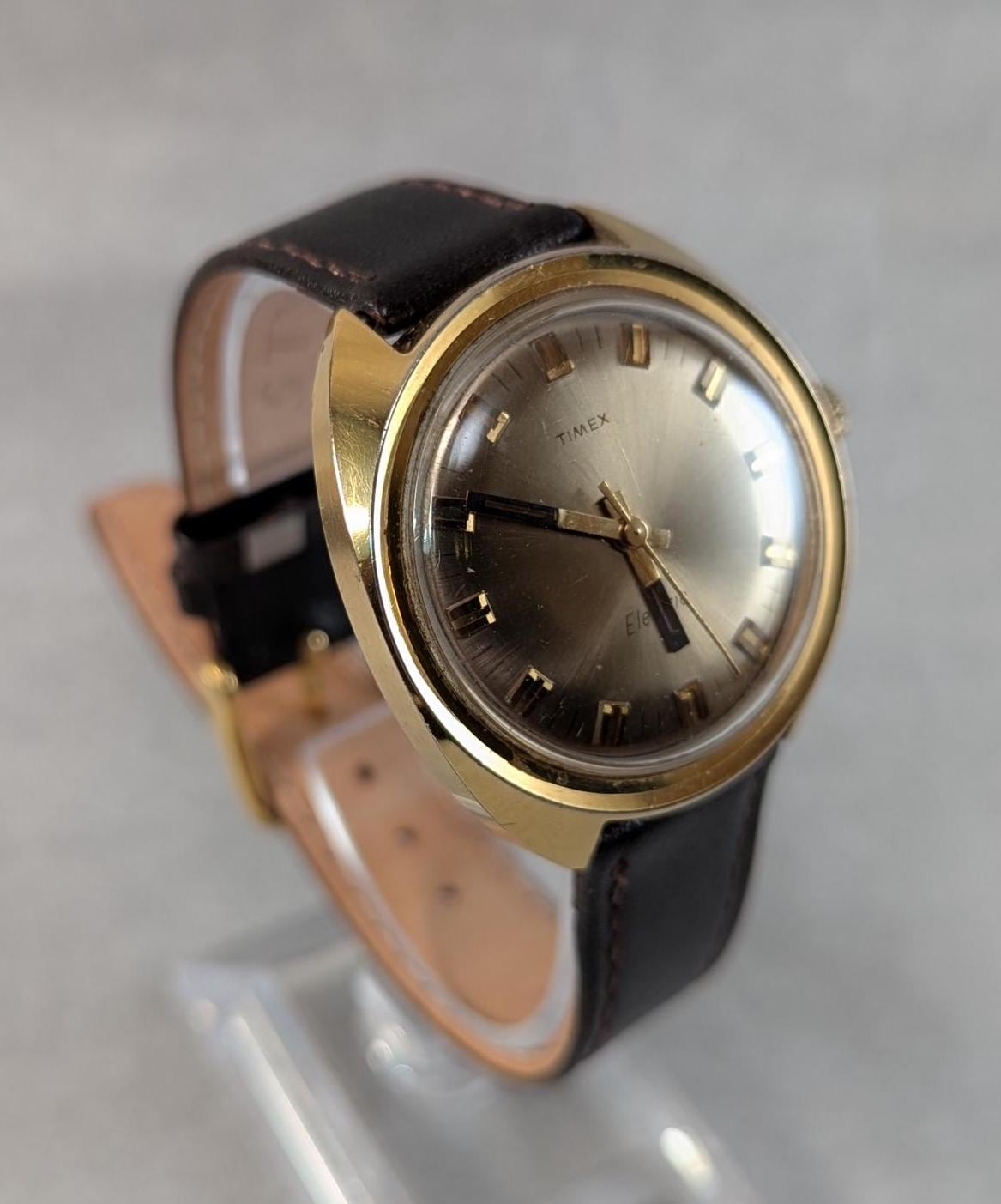 1970s Timex Electric Watch: Gold Tone Bezel, Retro Design
