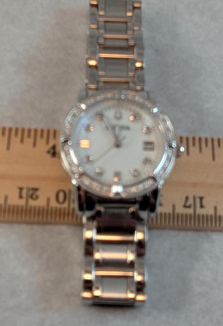 Wonderful Bulova Ladies Watch -Beautiful Mother of Pearl Dial and Fine Crystal Accents on Bezel Dial - Working with New Battery