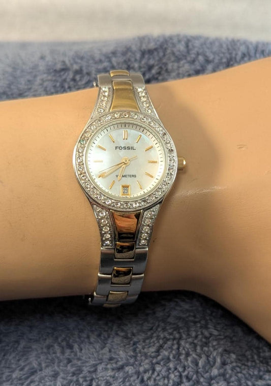 Fashionable and Stylish FOSSIL Ladies Watch - Silver and Gold Tone with MOP Dial and Crystal Bezel. Quartz Analog New Battery - Working