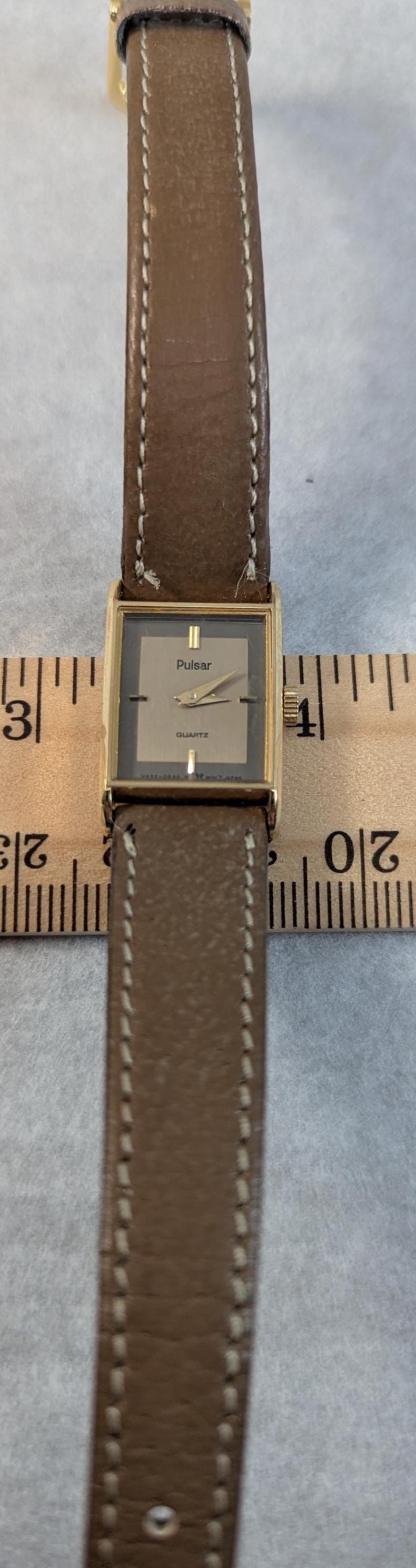 Ladies Pulsar V232-5520 Watch: Two-Tone Dial, Gold Bezel, Leather Band