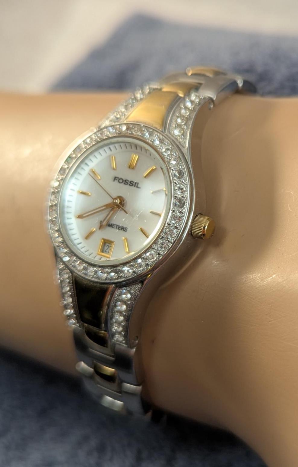 Fashionable and Stylish FOSSIL Ladies Watch - Silver and Gold Tone with MOP Dial and Crystal Bezel. Quartz Analog New Battery - Working