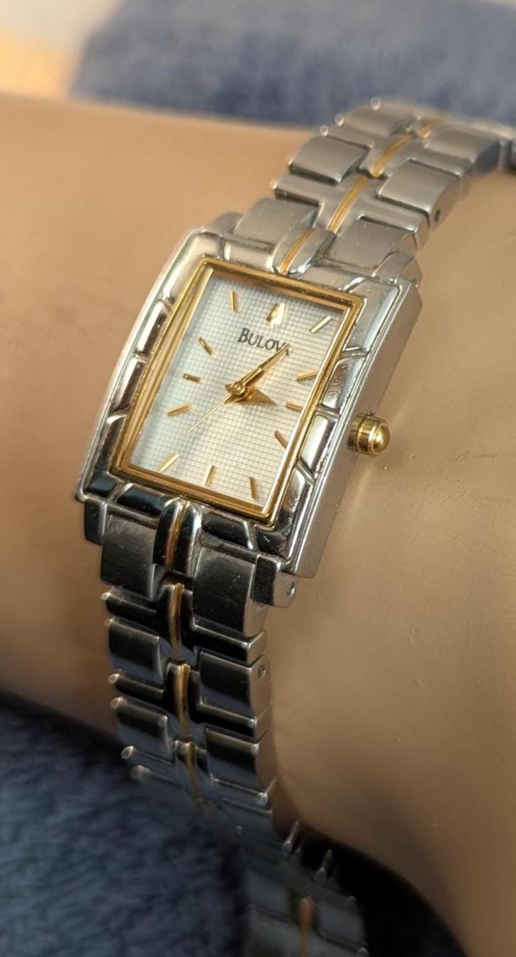 Awesome Bulova Ladies Watch Two Tone Model C9671103 White Dial with Bezel Accents - Small Stainless Steel Band - Working with New Battery