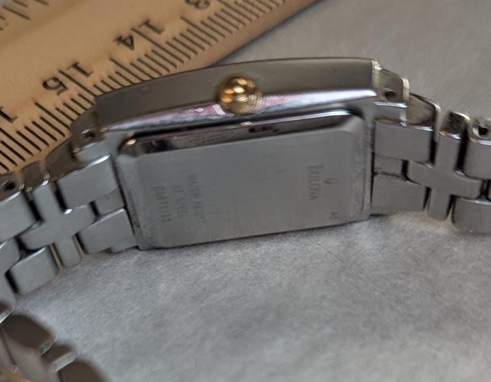 Awesome Bulova Ladies Watch Two Tone Model C9671103 White Dial with Bezel Accents - Small Stainless Steel Band - Working with New Battery